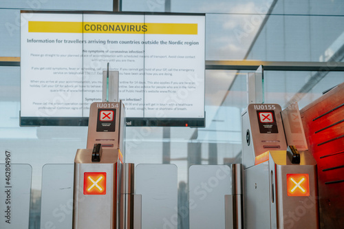 Information sign with safety regulations regarding coronavirus at Oslo airport, Norway photo