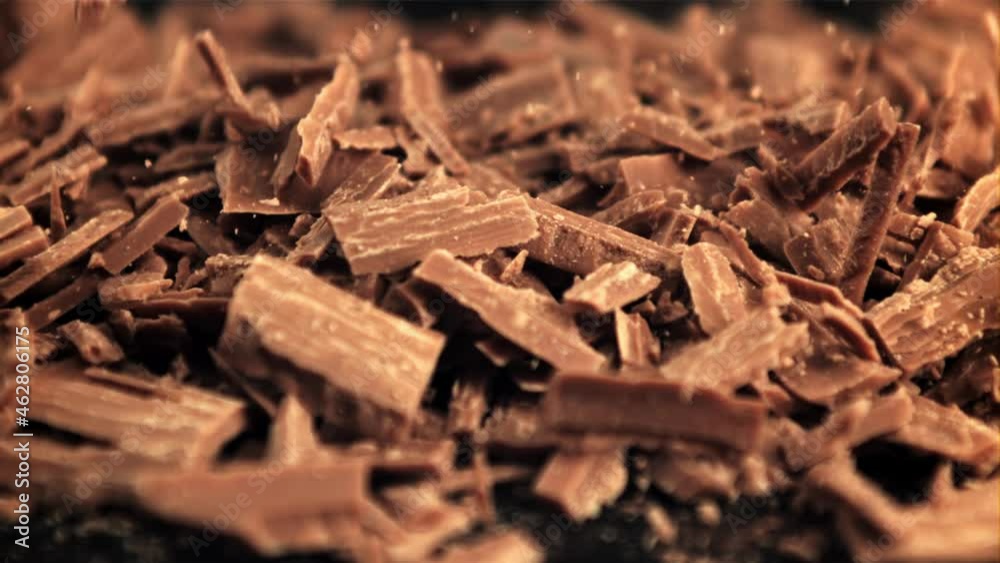 Super slow motion falling of grated milk chocolate. High quality FullHD footage Super slow motion falling of grated milk chocolate. High quality FullHD footage