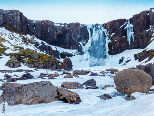 Iceland, Gufufoss waterfall frozen in winter before sunrise
