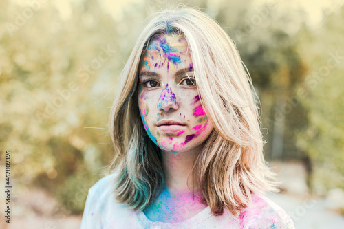 Gir Holi powder colours in her face, Germany