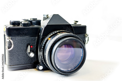 Analogue reflex camera on white background