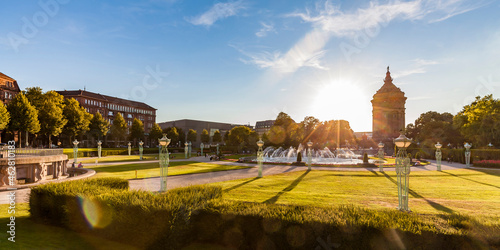 Germany, Mannheim, Friedrichsplatz with fountain and water tower at back light photo