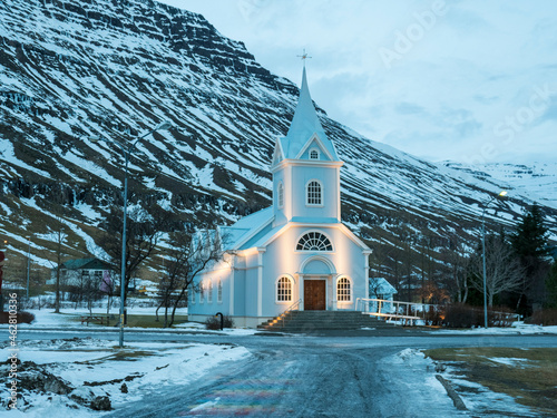 Iceland, Seydisfjordur, Seydisfjardarkirkja church in winter before sunrise photo