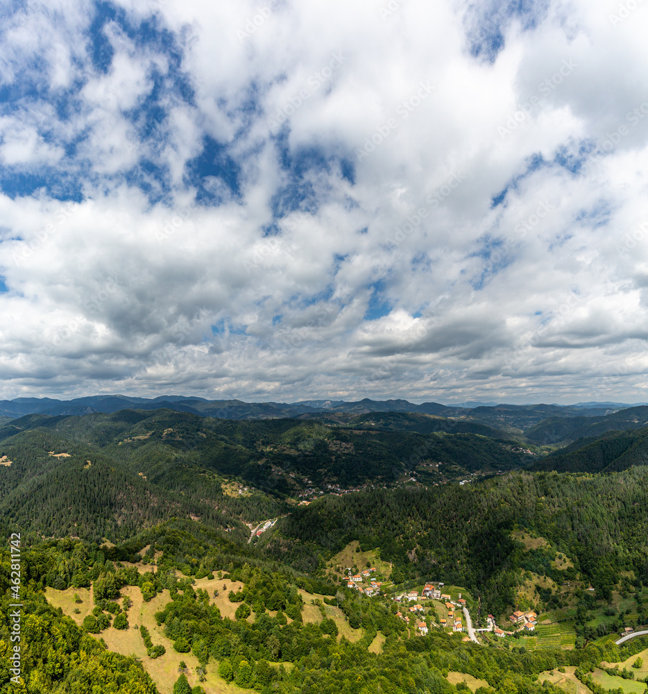 Mountain and forest with dramatic cloudy sky