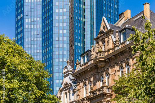 Low angle view of buildings and trees in Frankfurt, Germany photo