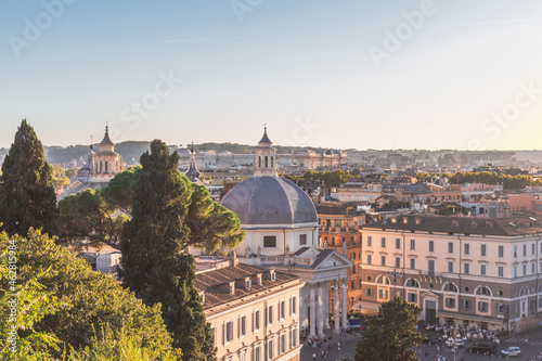 Italy, Rome, Santa Maria in Montesanto church and surrounding city buildings photo