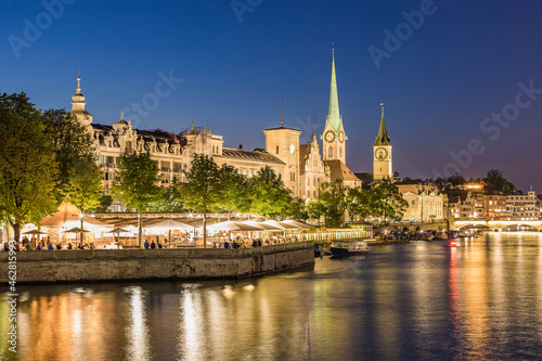 Switzerland, Canton of Zurich, Zurich, River Limmat and illuminated old town waterfront buildings at dusk
