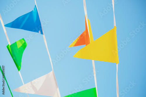 Colourful pennons in blue sky