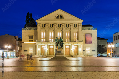 Germany, Thuringia, Weimar, Theaterplatz, German National Theater with Goethe and Schiller statues at night