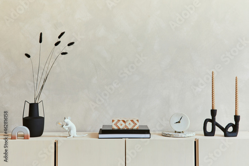 Tableau sur toile Elegant composition of stylish living room intrerior with beige sideboard and minimalistic personal accessories