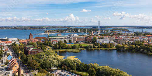 Germany, Mecklenburg-Western Pomerania, Stralsund, Coastal town with clear line of horizon over Baltic Sea in background photo