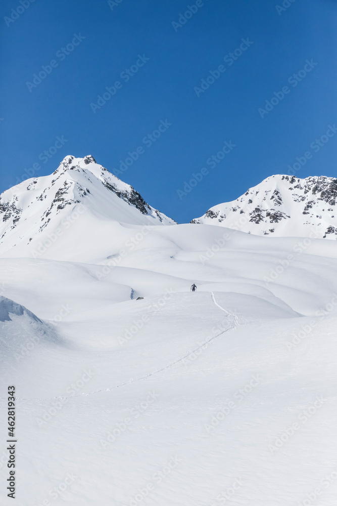 Austria, Tyrol, between Ischgl and Galtuer, Hohe Koepfe, ski tourer climbing up to the summit in winter Austria, Tyrol, between Ischgl and Galtuer, Hohe Koepfe, ski tourer climbing up to the summit in winter