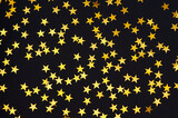 Star confetti background. Black background