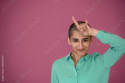 Portrait of a confident woman gesturing photo