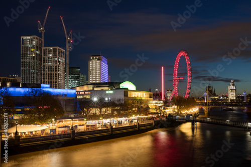United Kingdom, England, London, Queen Elizabeth Hall, Royal Festival Hall and London Eye at River Thames at night photo