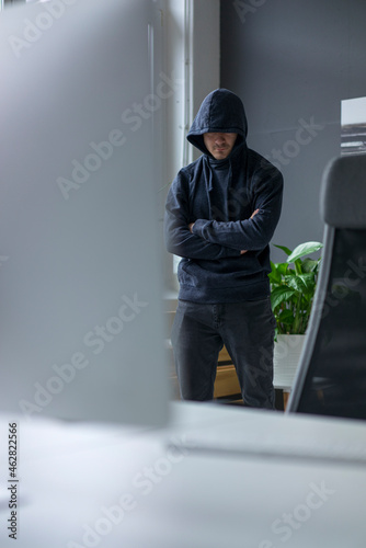 Anonymous teenager hacking PC photo