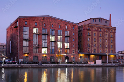 Germany, Muenster, City harbour, Kreativkai, Hall of Arts in the evening light photo