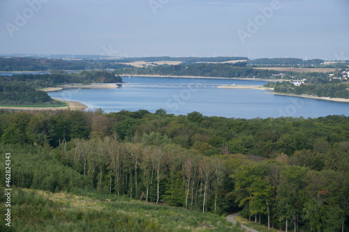 High angle view of sea amidst land against sky during sunny day, Delecke, North Rhine Westphalia, Germany