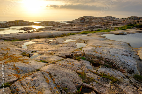 Sweden, Vastra Gotaland County, Grebbestad, Rocky landscape of Tjurpannans Nature Preserve at sunset