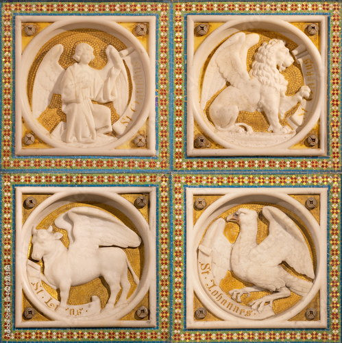 VIENNA, AUSTIRA - JUNI 24, 2021: The relief of Four Evangelists on the sidealtar of Votivkirche cathedral from 19. cent. photo