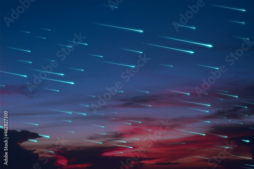 blue meteors rain on the sunset night sky dark cloud