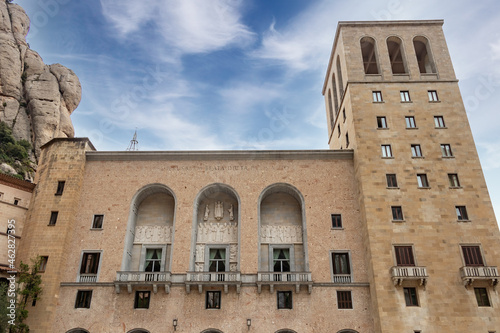 Facade of Basilica and monastery of Montserrat with the text in latin 