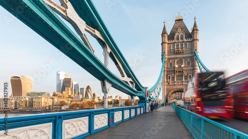 UK, England, London, Blurred motion ofÔøΩdouble-deckerÔøΩbus driving across Tower bridge at dawn photo