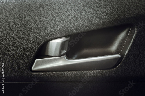 Car interior details of door handle. photo