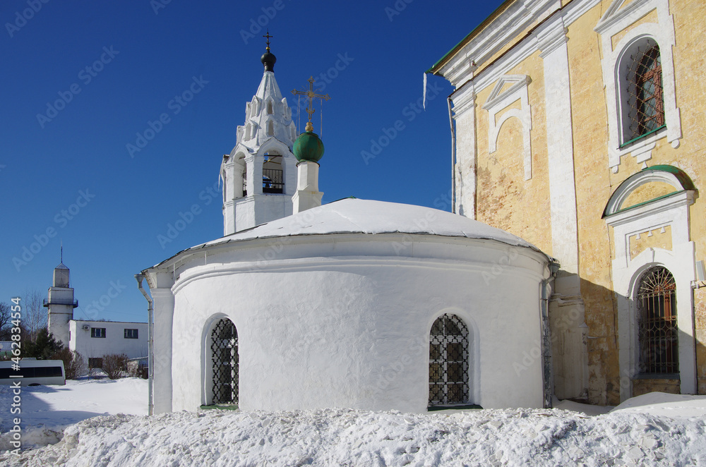 Vladimir, Russia - March, 2021: Ancient city street in winter sunny day. Saint George Cathedral