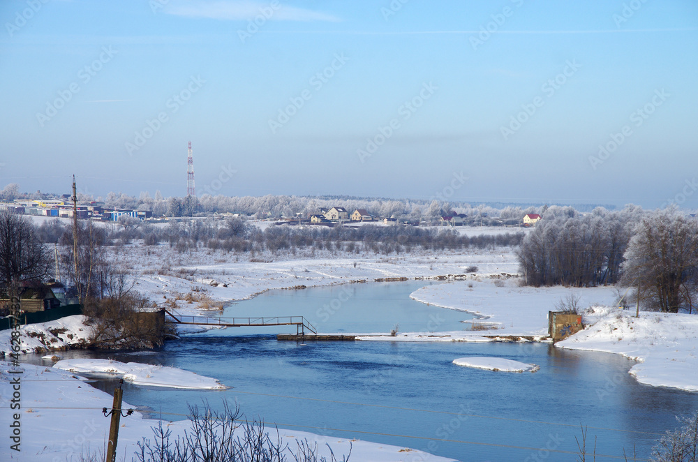 Mozhaisk, Russia - February, 2021: Winter view of the Moscow River and Ilyinskaya Sloboda