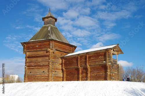 MOSCOW, RUSSIA - February, 2021: Winter day in the Kolomenskoye estate. Mokhovaya tower of Sumskoy stockaded fort with wooden wall photo