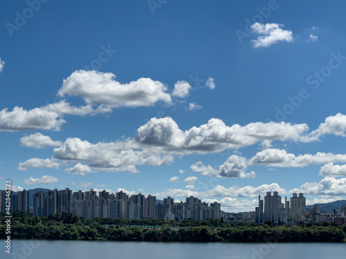 city skyline with beautiful white clouds in the blue sky 