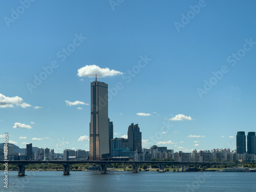 Photography modern city skyline with beautiful white clouds in the blue sky