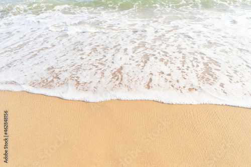 Clean sand texture with sea wave.Sea tropical sandy beach for Summer background banner