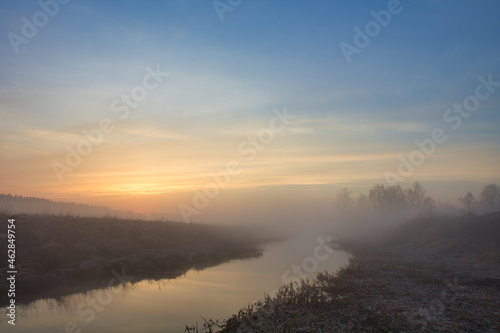 morning fog over the river red dawn