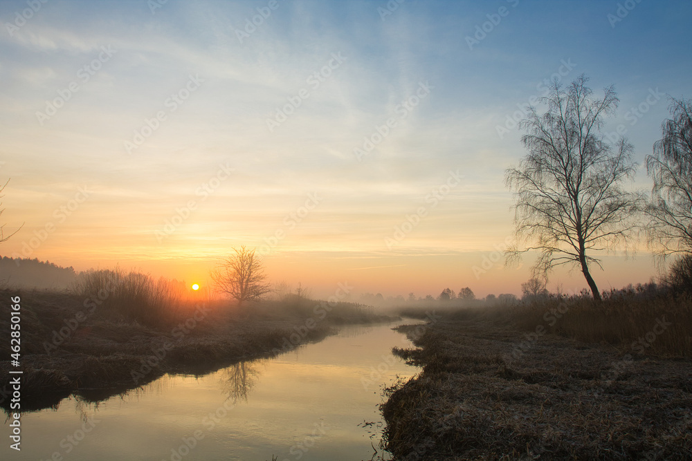 morning fog over the river red dawn