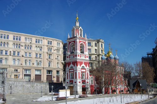 Moscow, Russia - March, 2021:  Bell tower and Church of St. George on Pskov hill in the landscape Park 
