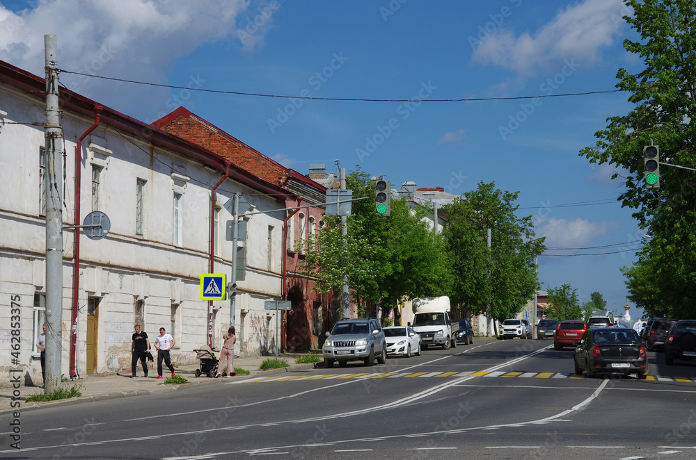 Fototapeta premium Rybinsk, Russia - May, 2021: View of the street of the city. Chkalov street