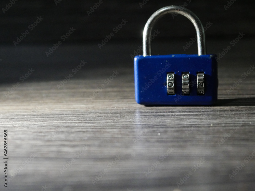 Fototapeta premium combination lock on a wooden background