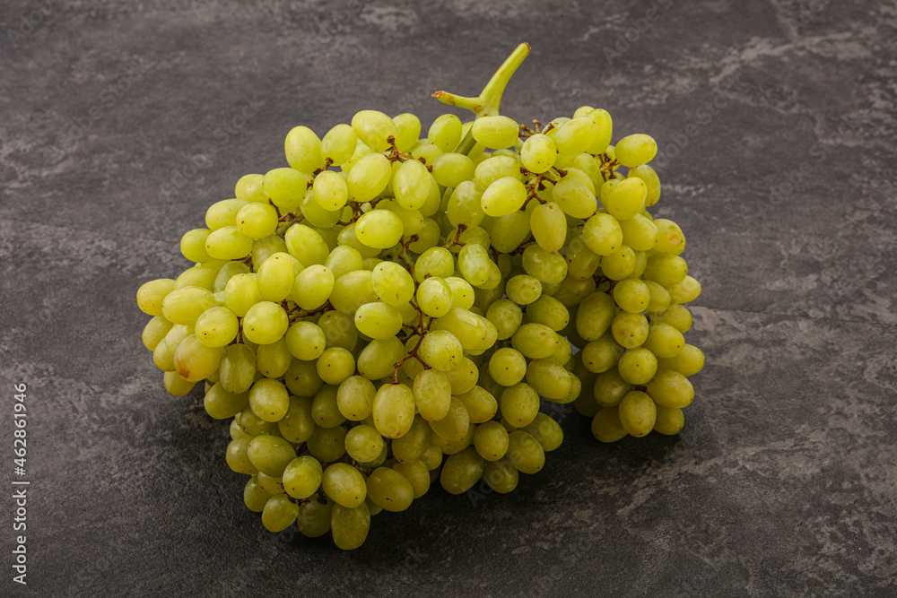 Green grape branch over background