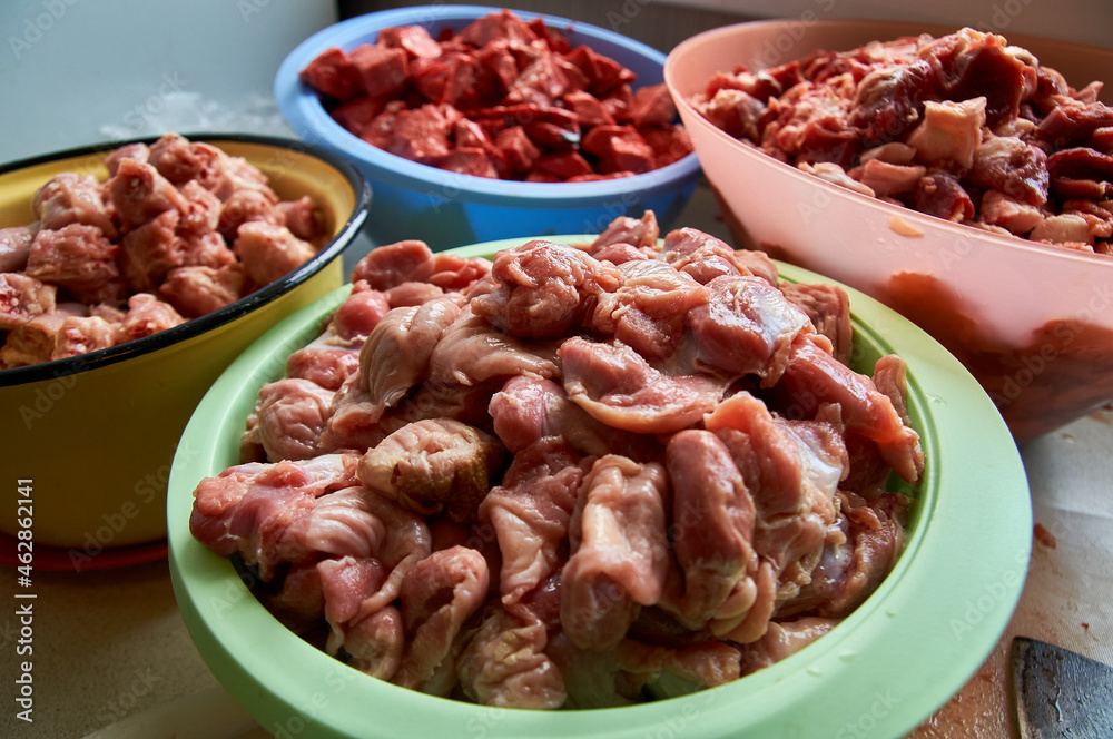 preparation of food for raw feeding. BARF food for dogs and cats. Packaging of food for animals.