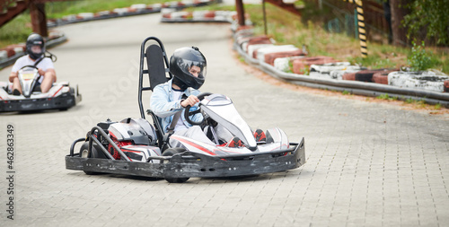 Karting. motorsport road racing with open-wheel four wheeled vehicles at go-karts © Kadmy