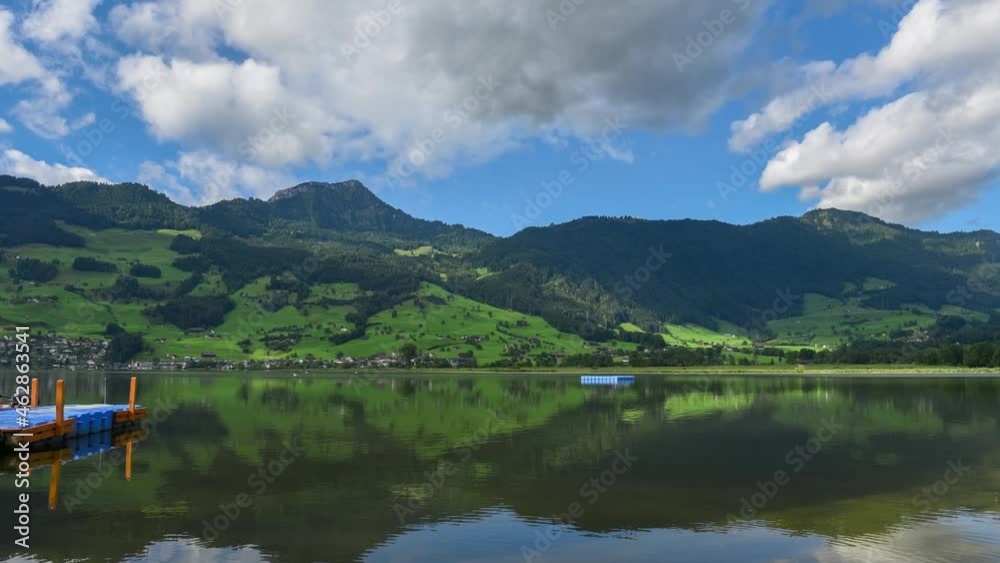 Time lapse beautiful mountains landscape with moving clouds in Switzerland Alps and Lake Lauerz Time lapse beautiful mountains landscape with moving clouds in Switzerland Alps and Lake Lauerz