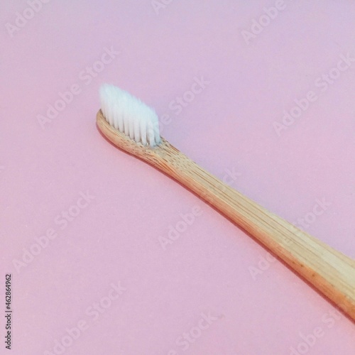 A soft-bristled toothbrush with a bamboo stem.