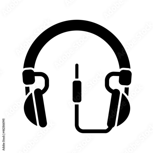 Wired circumaural headset black glyph icon. Over ear headset for music listening. Professional device connected to computer and phone. Silhouette symbol on white space. Vector isolated illustration photo