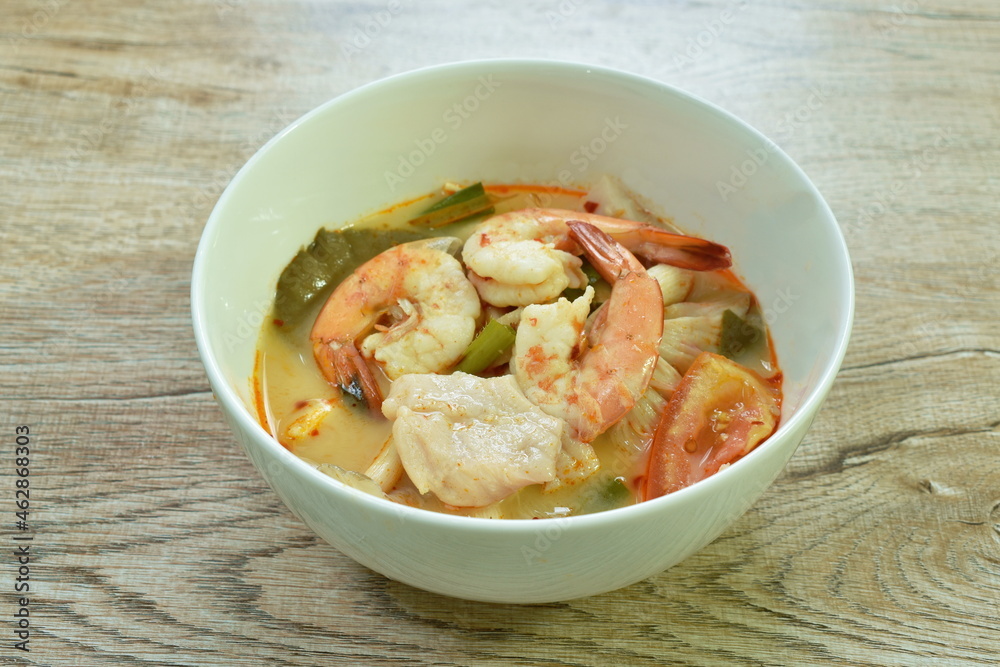 boiled river shrimp and bass fish with mushroom in Thai spicy soup or tom yum kung on bowl
boiled river shrimp and bass fish with mushroom in Thai spicy soup or tom yum kung on bowl