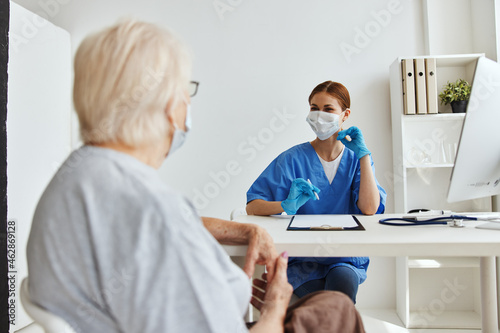 elderly woman and doctor professional examination health care