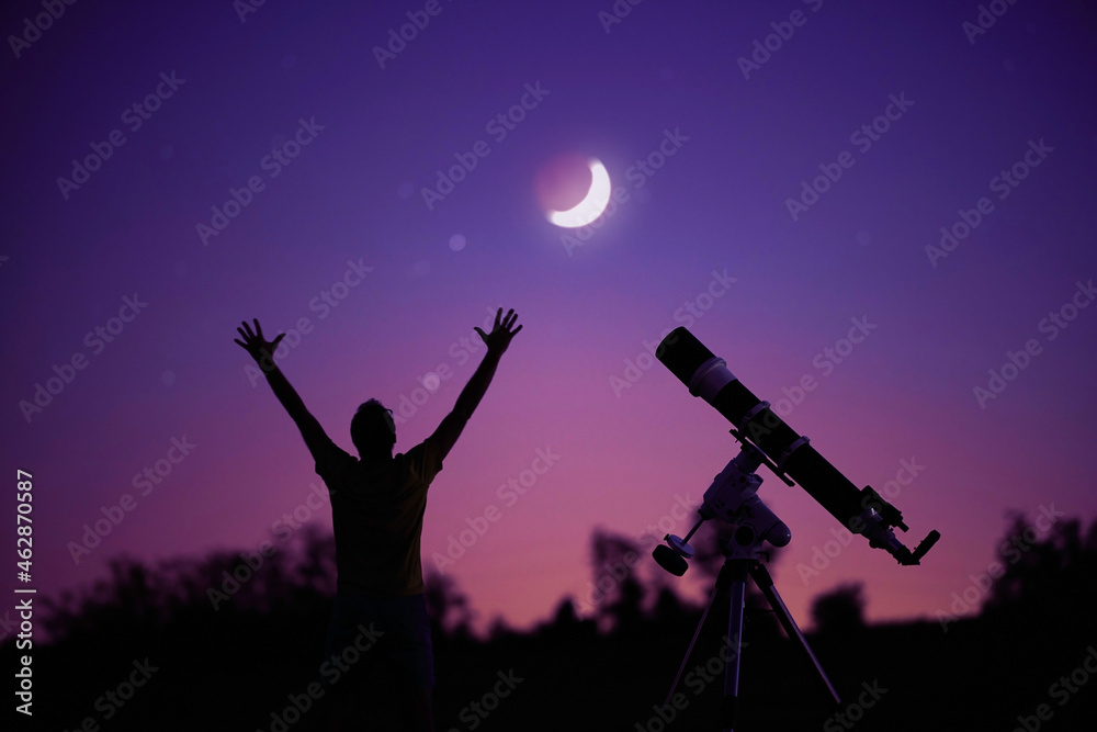 Silhouette of a man, telescope and countryside under the starry skies with young Moon. Silhouette of a man, telescope and countryside under the starry skies with young Moon.