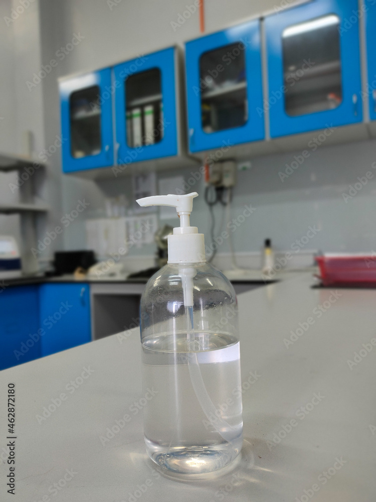 Malaysia, Perak, 14 October 2021: A bottle of hand sanitizer is on the laboratory table. Malaysia, Perak, 14 October 2021: A bottle of hand sanitizer is on the laboratory table.