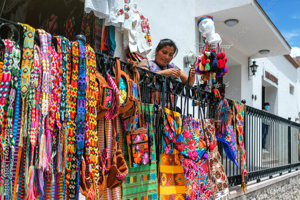 young adult latina woman opening a store young adult latina woman opening a store